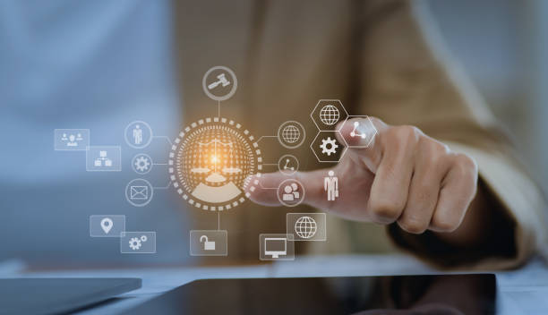 istock Lawyer hands holding digital tablet with law network interface icons. 1675375486