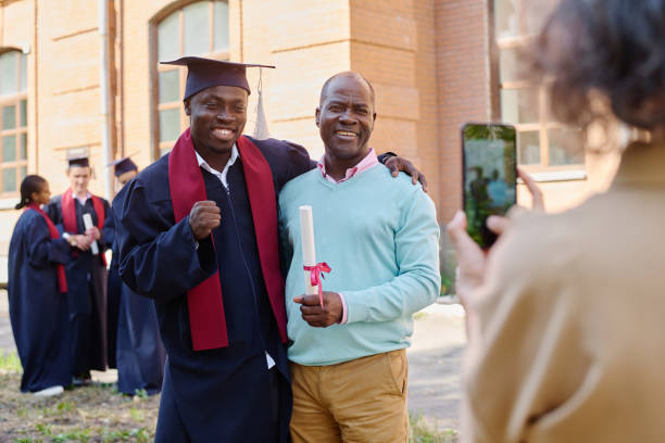 istock Graduated student making photo with his family 1675379774
