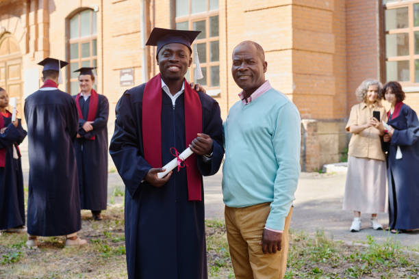 istock Parent supporting his son during graduation 1675379777
