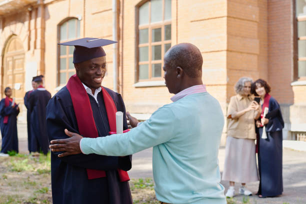 istock Dad congratulating his son with graduation 1675380303