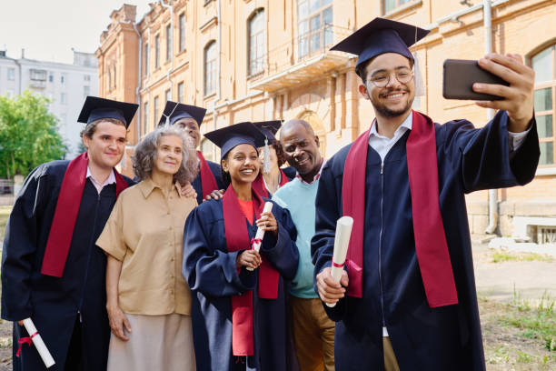 istock Graduated students making selfie portrait with parents 1675380335