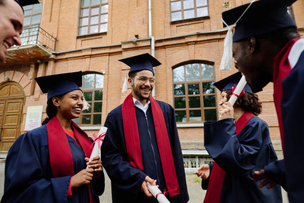 istock Graduated students happy to get diplomas 1675381399