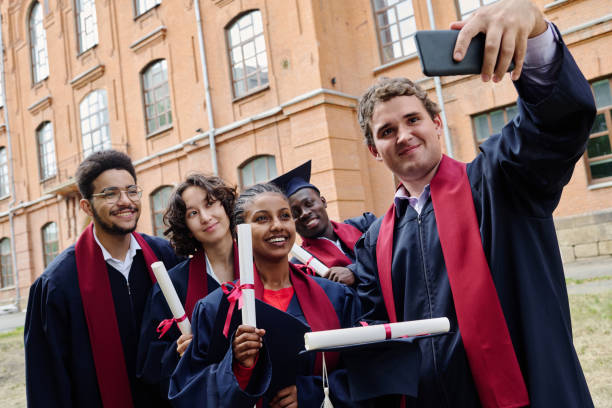 istock Graduated student making photo with his friends 1675381964