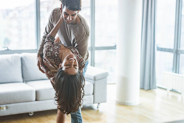 istock Young romantic couple enjoying in their dance at home. 1675421101