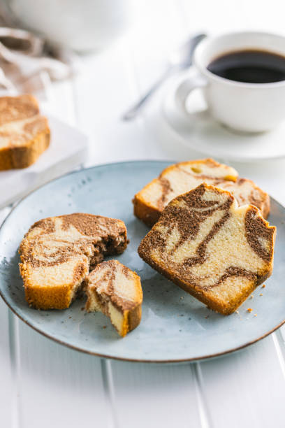 istock Marble sponge cake. Cake with cocoa and vanilla taste on plate. 1675460411