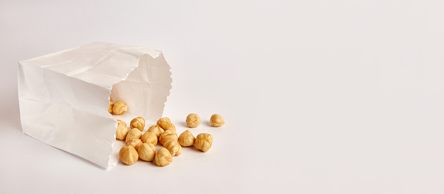 Hazelnuts fell out of the paper bag. Food packaging.