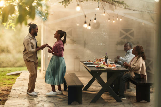 istock Happy black couples having fun on a party in the backyard. 1675521930