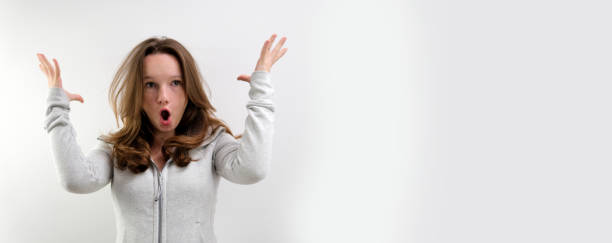 istock negative emotion of adolescence brain explosion girl with her hands shows how it explodes in her head experiences opens mouth waves hands boom strong explosion on a white background emotional teenager 1675526315
