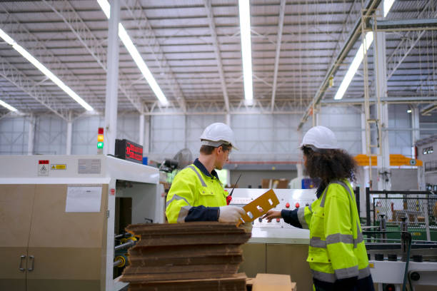 istock Blue collar worker work at cardboard box manufacturing factory. 1675548743