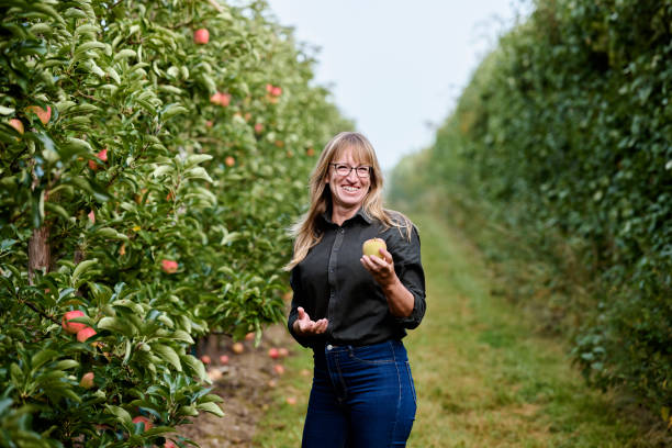 istock Woman looking at an apple 1675557161