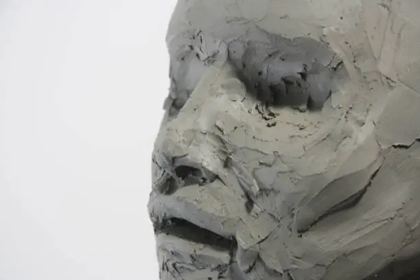 Photo of Close up face sculpture, details clay portrait. Fine art.