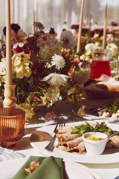 istock Restaurant autumn aesthetic table setting, flowers arrangement under sunlight shadows. Cozy setup with bouquet. 1675561084