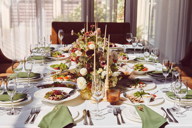 istock Elegant chamber table setting with candles and flowers aesthetics design under shadows. Provence wedding style 1675561103
