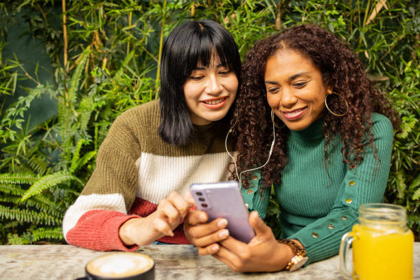 istock Two friends watching online content on the mobile phone 1675568389