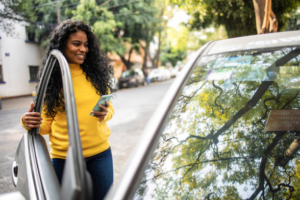 istock Getting a taxi with mobie app. 1675571197
