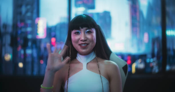 istock Screen Replacement: Japanese Female Having a Conversation on a Video Call, While Sitting Behind a Desk, Using a Futuristic Technological Office Space. Young Female Manager Working in Tech Support 1675572888