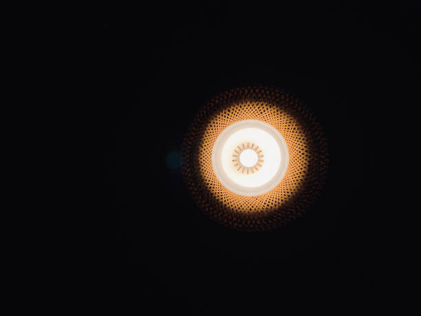 istock Lighting in the dark, close-up of light bulb. 1675574612