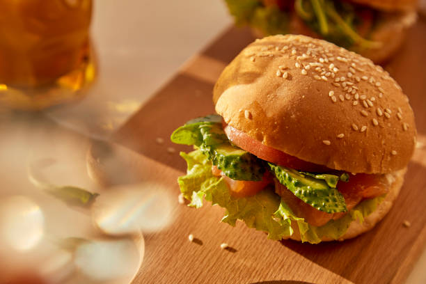 istock Handmade traditional fish burger with lettuce and cucumbers and smoked salmon. 1675592676