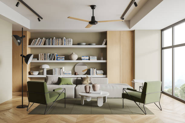 istock Cozy relaxing room interior with armchairs and couch, bookshelf and window 1675598124