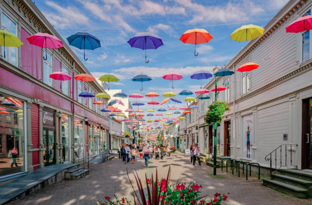 Trondheim, Norway - August 19 2022: An installation of colourful umbrellas above a street in the downtown of the city.
