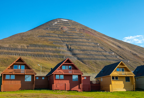 Colorful old coal mining houses on the hills of Longyearbyen, the world's northernmost settlement, Spitsbergen, Svalbard, Norway