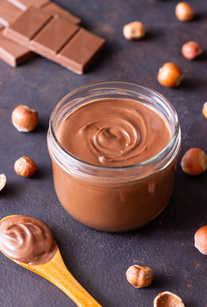 istock Chocolate paste with nuts in a jar. Dessert. Vegetarian food. 1675669304