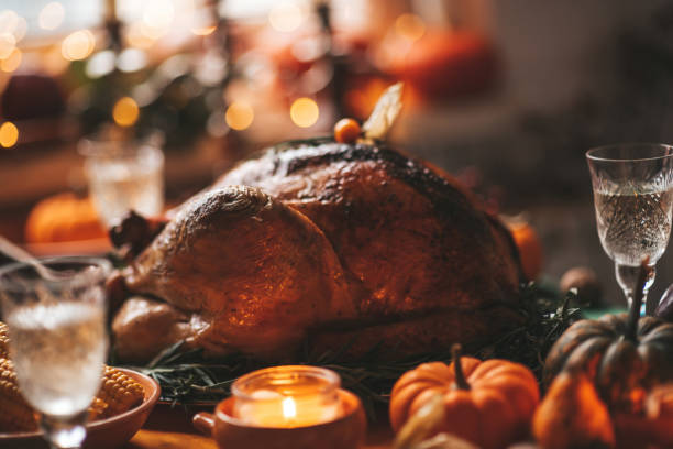 istock Thanksgiving holiday dinner table setting with fall decoration and pumpkins 1675683666