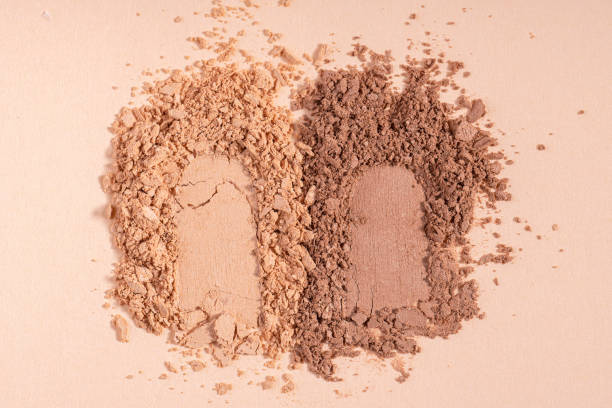istock Makeup cosmetics. Eyeshadow or blush crushed palette, colorful eye shadow powder on beige background 1675691880
