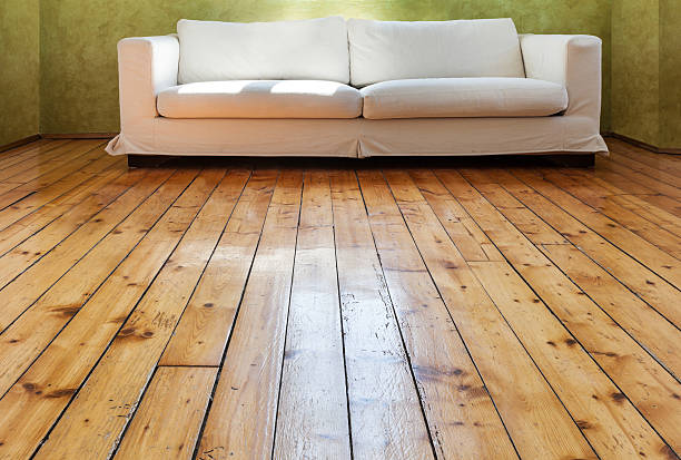 istock A white divan sofa on a polished wooden floor 167570858
