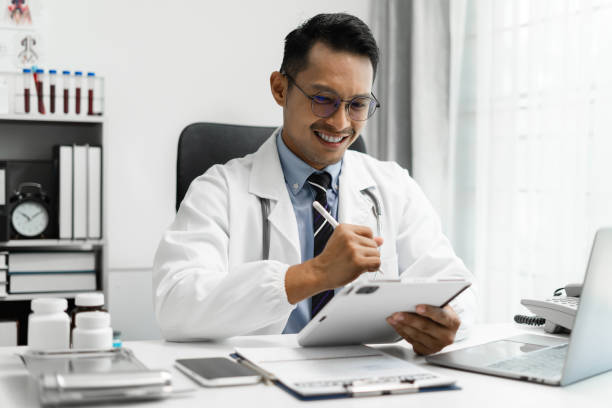 istock Doctor work on digital tablet healthcare doctor technology tablet using computer in a modern office  in the morning at the desk. 1675709418
