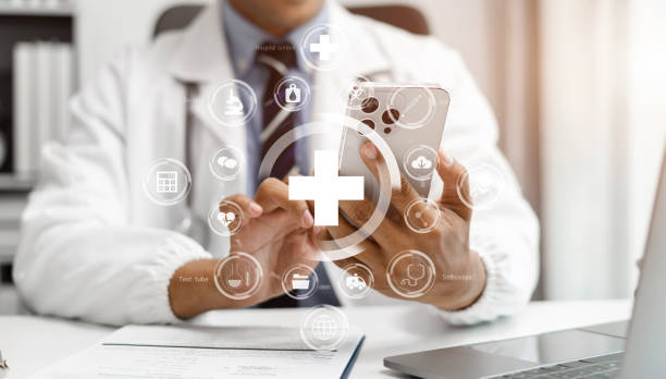 istock Medical Technology Concepts, Doctor is working on a smartphone and laptop computer in a modern office  in the morning at the desk. 1675709797
