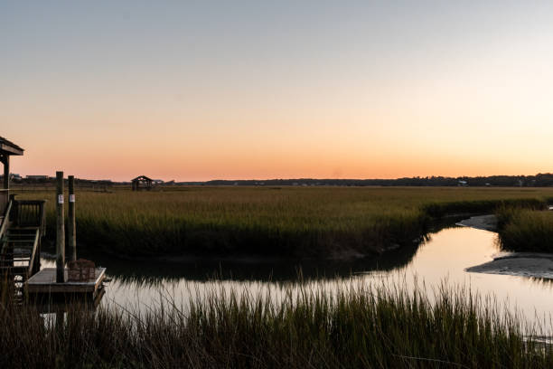 istock Sunset over the salt water marsh 1675719744