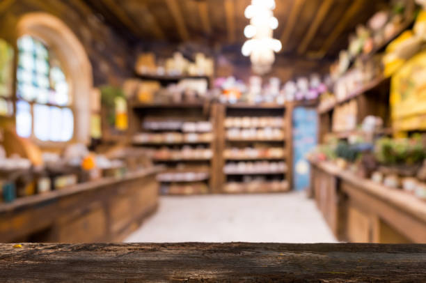 A rustic wooden countertop stands out against a softly blurred background of a pharmacy or herbal shop, perfect for product displays.