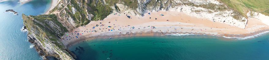 Most Beautiful High Angle Panoramic View of British Landscape and Sea View of Durdle Door Beach of England Great Britain, UK. Image Was captured with Drone's camera on September 9th, 2023