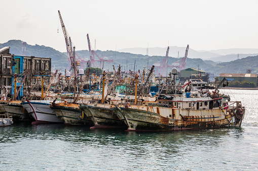 Fishing boats near Colorful Zhengbin Fishing Port visiting in Keelung. landmark and popular for tourists attractions near Taipei city, Taiwan.