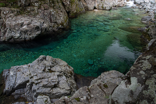 rocks in turquoise river in the verzasca valley in the swiss ticino canton