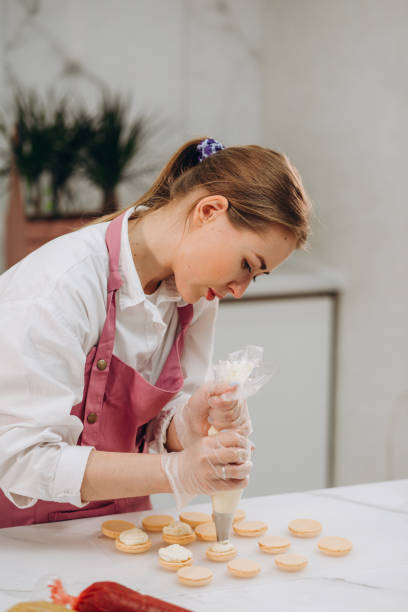 istock A confectioner makes macaroons in a pastry shop. 1675776506