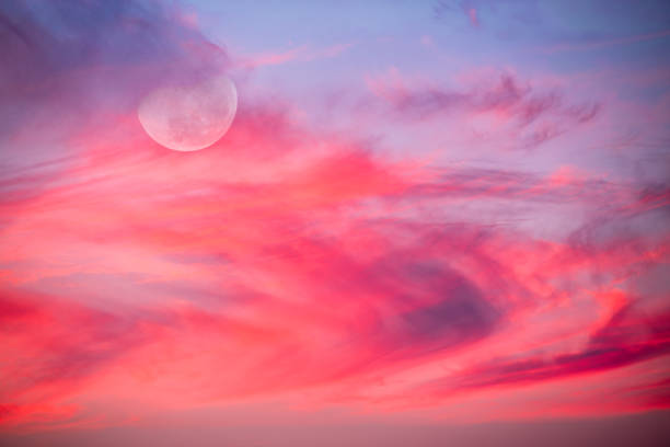 Ethereal Surreal Full Moon Colorful Nature Abstract A Full Moon Is Rising In A Colorful Sunset Blue Daytime Sky red full moon stock pictures, royalty-free photos & images