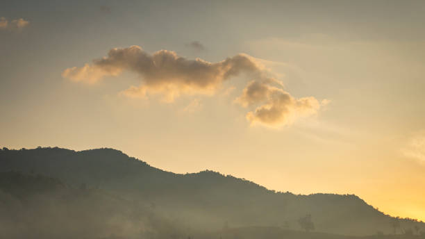 istock The tall green mountains were covered with white mist. 1675792792