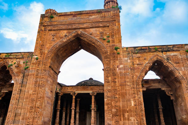 istock ancient grand mosque called Adhai Din Ka Jhonpra vintage architecture with bright blue sky at day 1675800415
