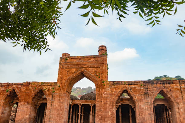 istock ancient grand mosque called Adhai Din Ka Jhonpra vintage architecture with bright blue sky at day 1675802549