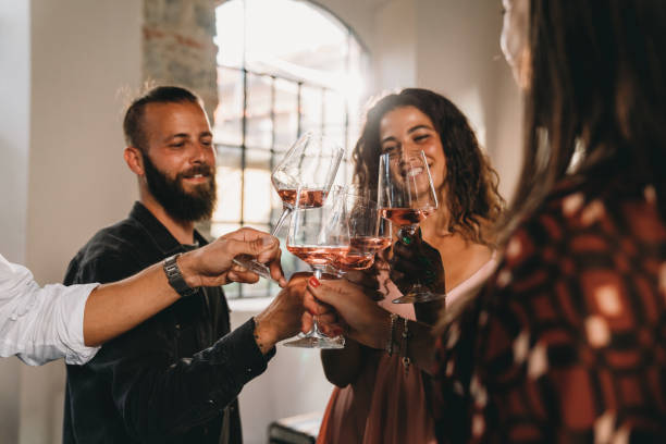 istock Friends are celebrating together with wine glasses 1675804775