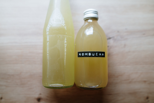 A small glass bottle with kombucha drink