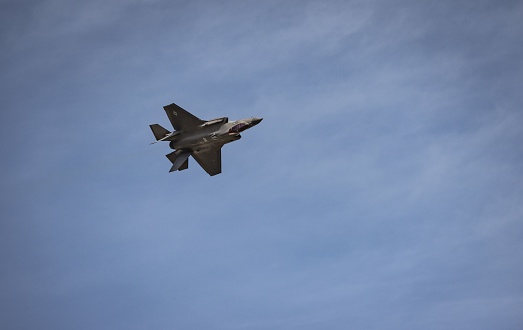 Westfield, United States – May 27, 2023: A United States Air Force F-35 flighting inverted during a demonstration at an airshow.