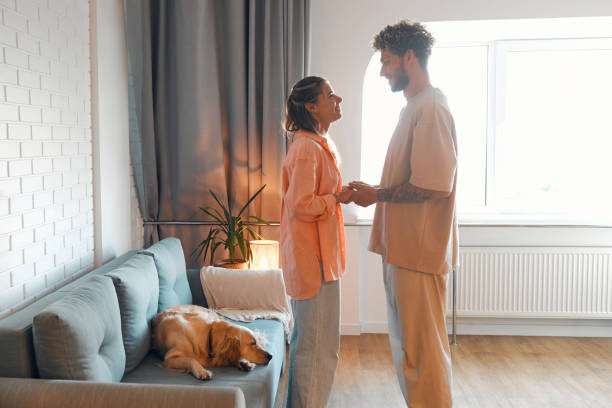 istock Young couple in love spending time together at home 1675829227