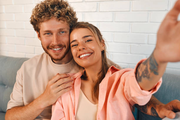 istock Young couple in love spending time together at home 1675829253