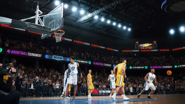 Slow Motion Replay Footage with Two International Teams Playing Basketball at an Arena Crowded with Spectators. White Team Pass the Ball, Player Scoring a Beautiful Goal During an Intense Game