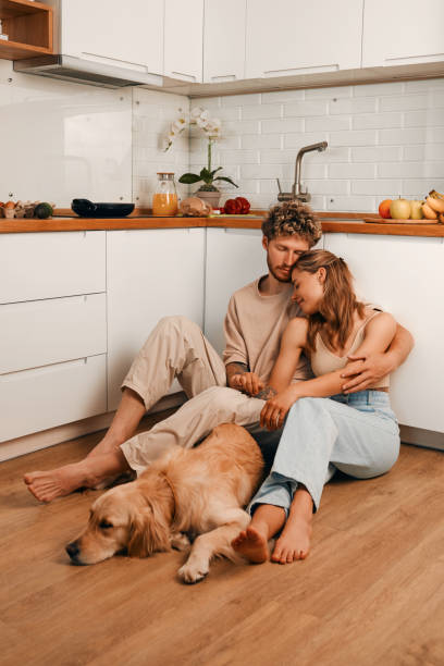 istock Young couple in love spending time together at home 1675831059