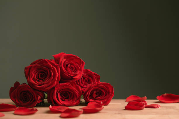 istock bouquet of red roses on green background 1675841228