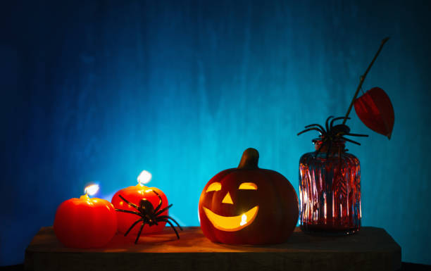 istock halloween decorations with pumpkin on dark wooden background 1675841266